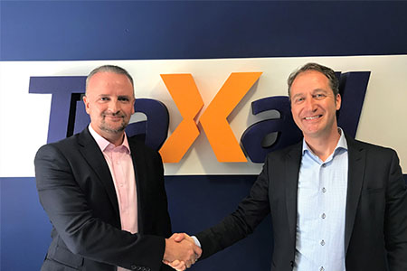 Ross Jackson shakes hands with Leomont Wouda, international Business Director of TraXall
