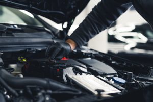 Close-up,Shot,Of,Unrecognisable,Man,Wearing,Black,Glove,Inspecting,Car